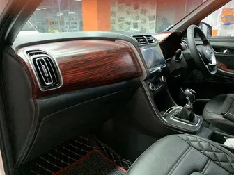 Automotive dashboard interior trim in luxury mahogany finish