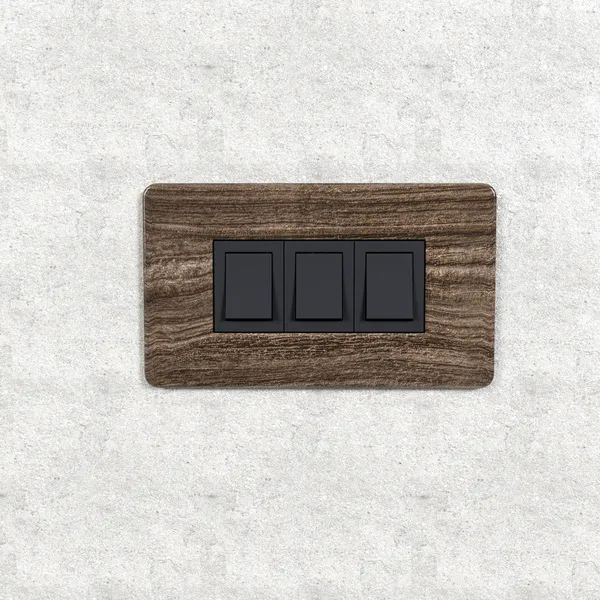 Designer switchboard plates in marble and wood finishes